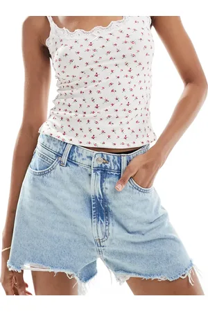 ASOS Pantalones cortos vaqueros azules de corte acampanado con lavado claro de ASOS DESIGN