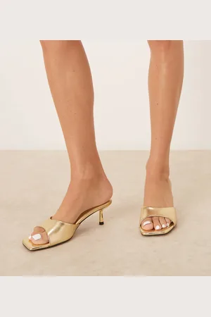 ASOS Mules dorados de tacón bajo Hyped de Wide Fit