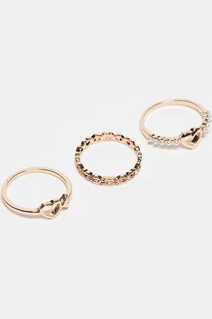 ASOS Pack de 3 anillos dorados con detalles de corazones de