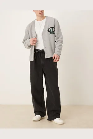 ASOS Vaqueros de pernera ancha con lavado negro, pinzas y detalle de lazada anudada de