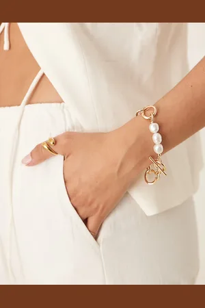 ASOS Pulsera dorada de cadena con cierre en forma de T y detalles de perlas de imitación de