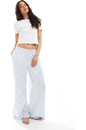 Hollister Pantalones de pijama holgados de talle medio con estampado de corazones azules y cinturilla del logo de franela de