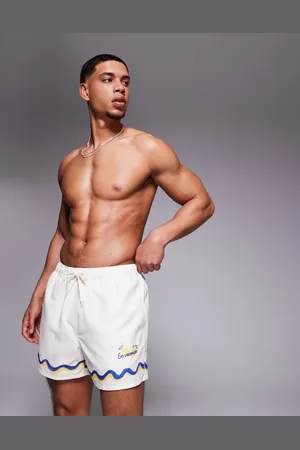 ASOS Shorts de baño cortos color con ribetes estampados de -Neutro