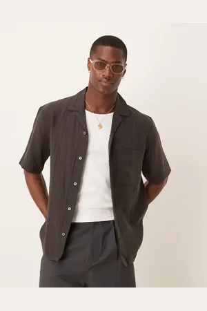 MANGO Camisa marrón holgada de manga corta de tejido texturizado de algodón de