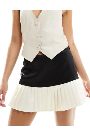 Kaiia Minifalda negra con bajo plisado color crema en contraste exclusiva de -Negro