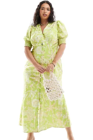 Never Fully Dressed Vestido semilargo verde con estampado amarillo dorado Lindos de