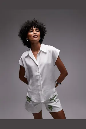 MANGO Camisa blanca clásica sin mangas con bajo redondeado de satén de