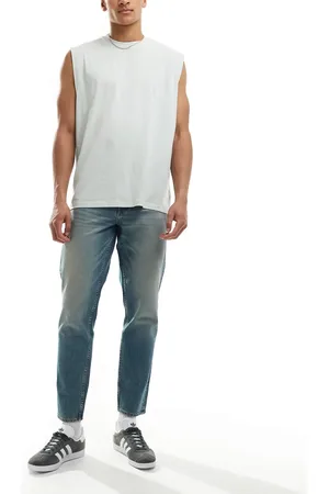 ASOS Vaqueros azules de corte tapered con lavado claro y acabado tintado de