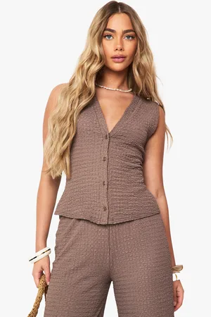 Boohoo Top Sin Mangas Texturizado Con Botones