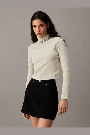 Calvin Klein Top slim de canalé de algodón con cuello vuelto