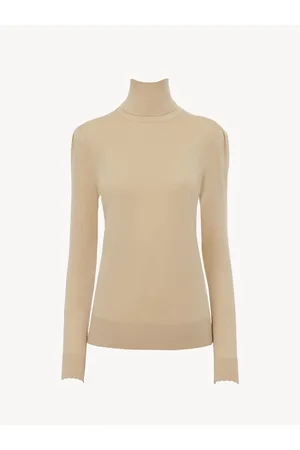 Jersey beige cuello alto oversize mujer