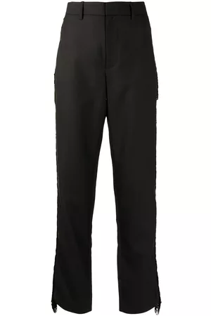 DION LEE Pantalones con detalle de flecos
