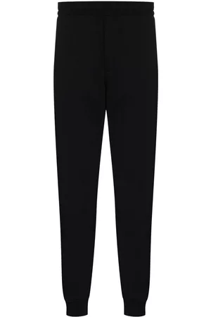 Alexander McQueen Pantalones de chándal rectos con franja del logo