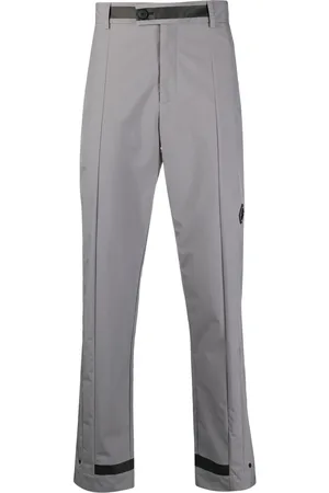 A-cold-wall* Pantalones rectos con placa del logo