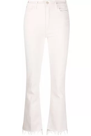 Mother Vaqueros bootcut con bajos deshilachados