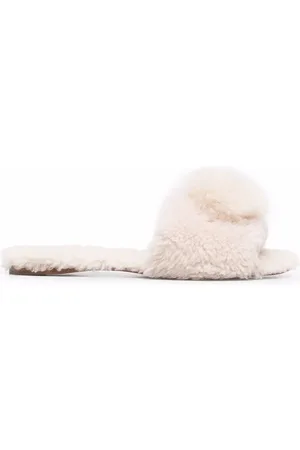 Aquazzura Sandalias planas Foxy con pompón