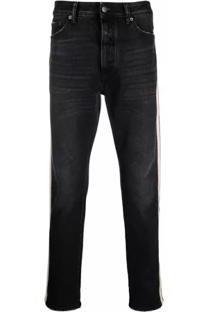 Palm Angels Vaqueros slim con rayas laterales