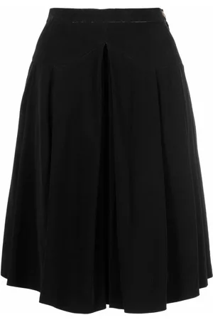 CHANEL Falda plisada con botón CC 1990