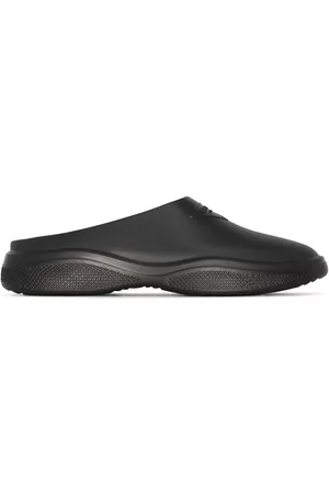 Prada Mules Mellow con aplique del logo
