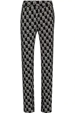 We11 Done Pantalones de punto con monograma