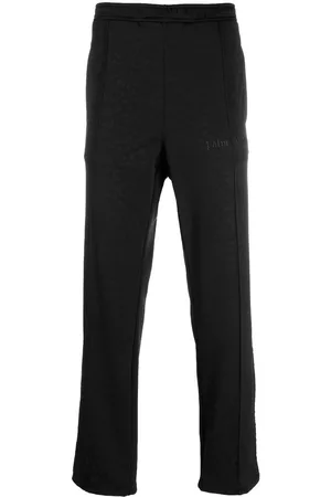 Palm Angels Pantalones de chándal con motivo de leopardo