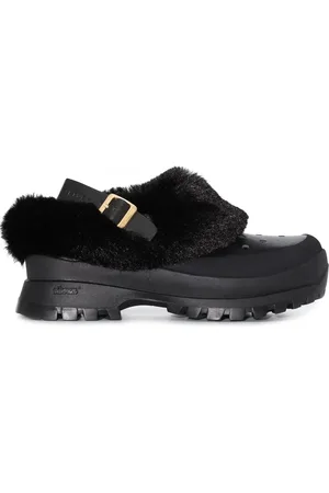 Stella McCartney Mules Trace con ribete de pelo artificial