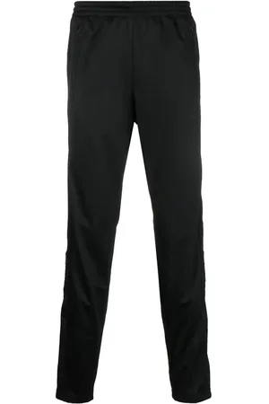 adidas Pantalones de chándal con parche del logo