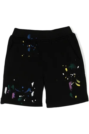 MOSTLY HEARD RARELY SEEN Bermudas con manchas de pintura
