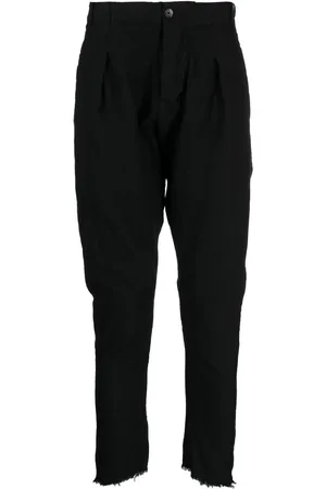 MASNADA Pantalones ajustados con dobladillo deshilachado