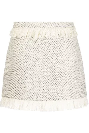 KIMHEKIM Falda corta con detalle de flecos