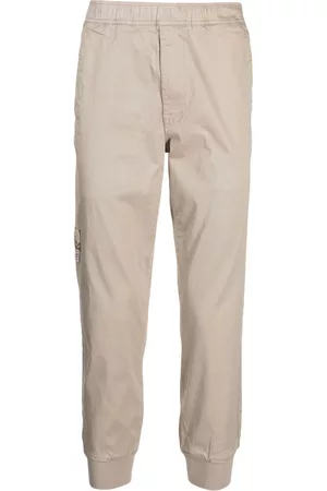 A Bathing Ape Pantalones ajustados con logo estampado