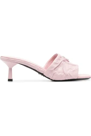 Prada Mules acolchados con placa del logo
