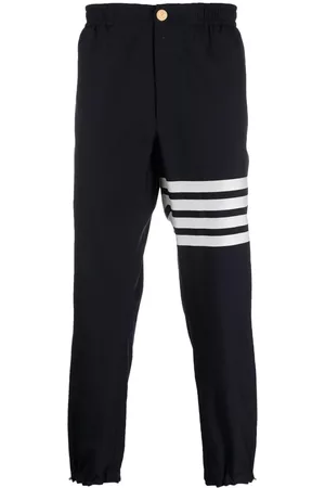 Thom Browne Pantalones con bajos elásticos y motivo 4-Bar
