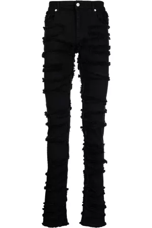 1017 ALYX 9SM Vaqueros skinny con efecto envejecido