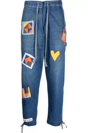 GREG LAUREN Vaqueros con detalle de parche