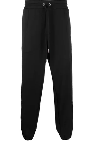Moncler Pantalones de chándal con rayas laterales