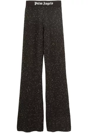 Palm Angels Pantalones acampanados con logo estampado