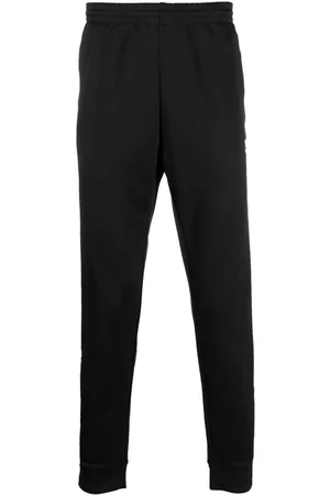 adidas Pantalones de chándal ajustados con logo bordado