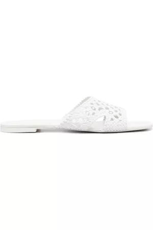 Tory Burch Mules con cortes a láser