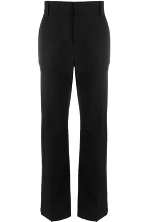 VALENTINO GARAVANI Pantalones de vestir con aplique Rockstud