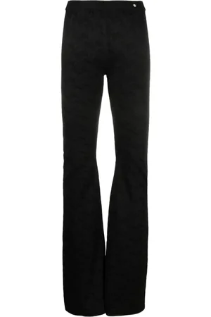 VERSACE Pantalones acampanados de punto Greca