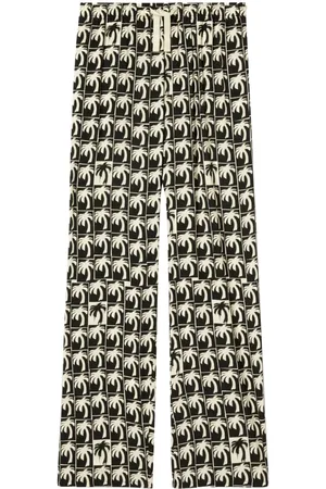 Palm Angels Pantalones anchos con motivo de palmeras