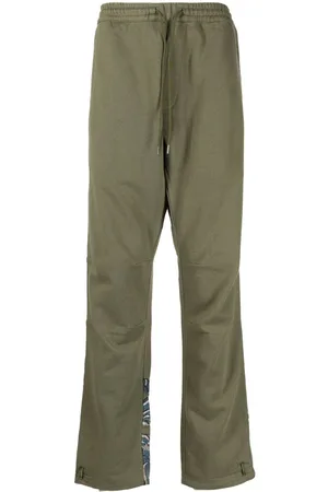 Maharishi Pantalones con dragón estampado