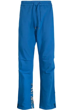 Maharishi Pantalones con dragón estampado