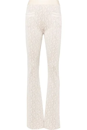 Palm Angels Pantalones acampanados de talle medio
