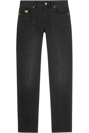 VERSACE Vaqueros slim con aplique Medusa Head