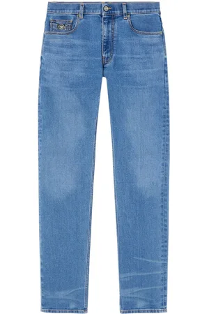 VERSACE Vaqueros slim con aplique Medusa Head