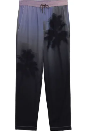 Simkhai Pantalones Allister con palmeras estampadas