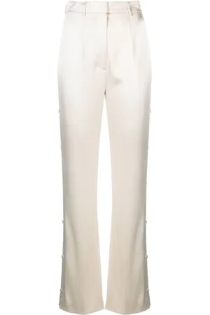 Nanushka Pantalones Felina con botón lateral