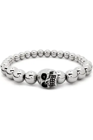 Alexander McQueen Pulsera con charm de calavera y cuentas